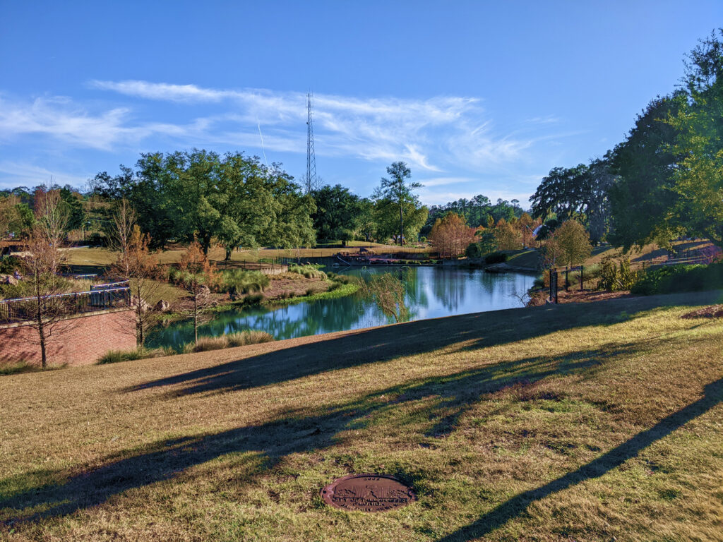 Photo of Cascades Park with a pond in in the middle