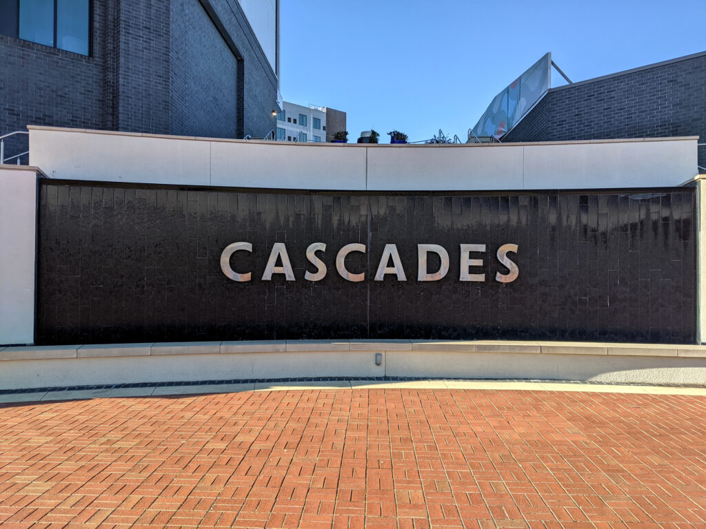 A fountain with a sign saying CASCADES